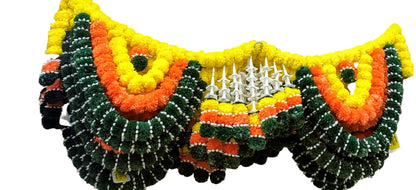 Decorative flower garlands with orange, green, and yellow colors on a store shelf.